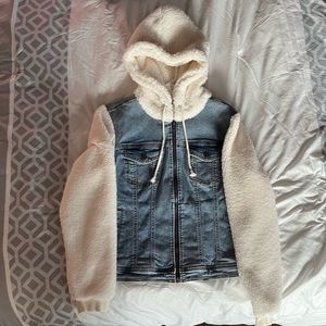 Jean jacket with white fuzzy sleeves and hood